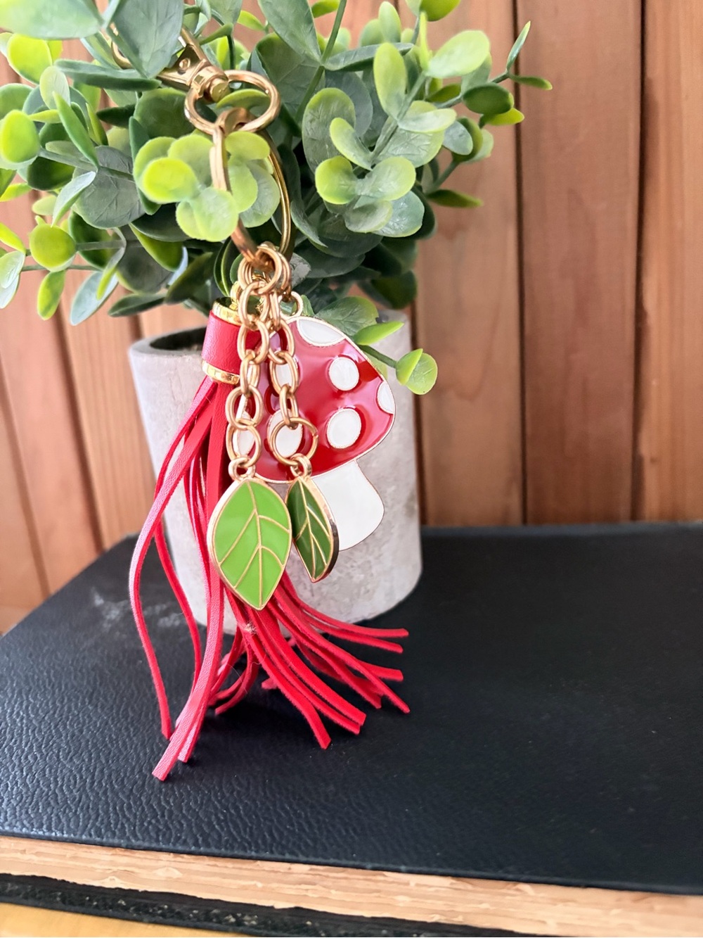 Enameled Mushroom and Leather Tassel Keychain with Green Leaf Charms
